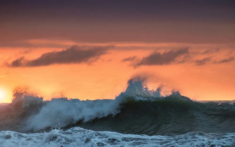 storm waves at sunset