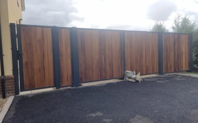 Steel Clad Timber Gates Fashioned from Weather Resistant Iroko Hardwood