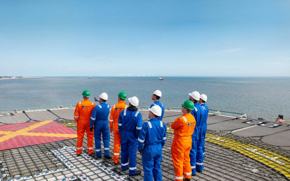site workers standing near sea
