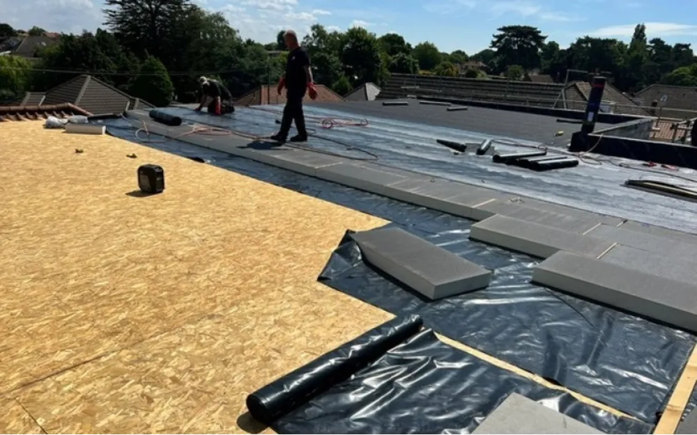 Insulation being installed on new roof
