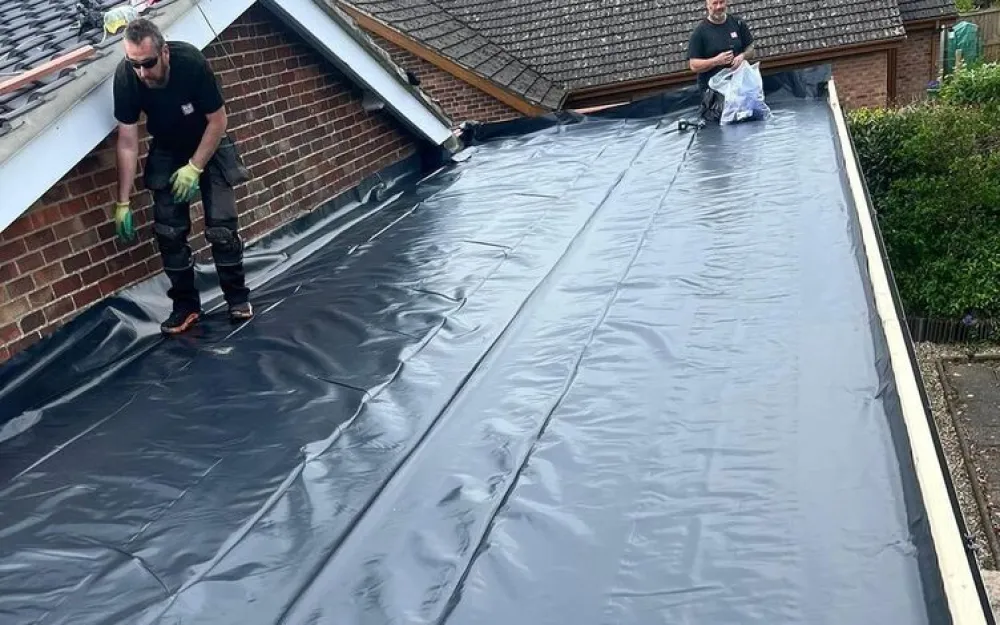 Vapur control layer being installed on new roof